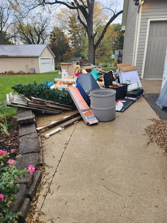 Dumpster being loaded with debris for Demolition Dumpster Rental in Salisbury